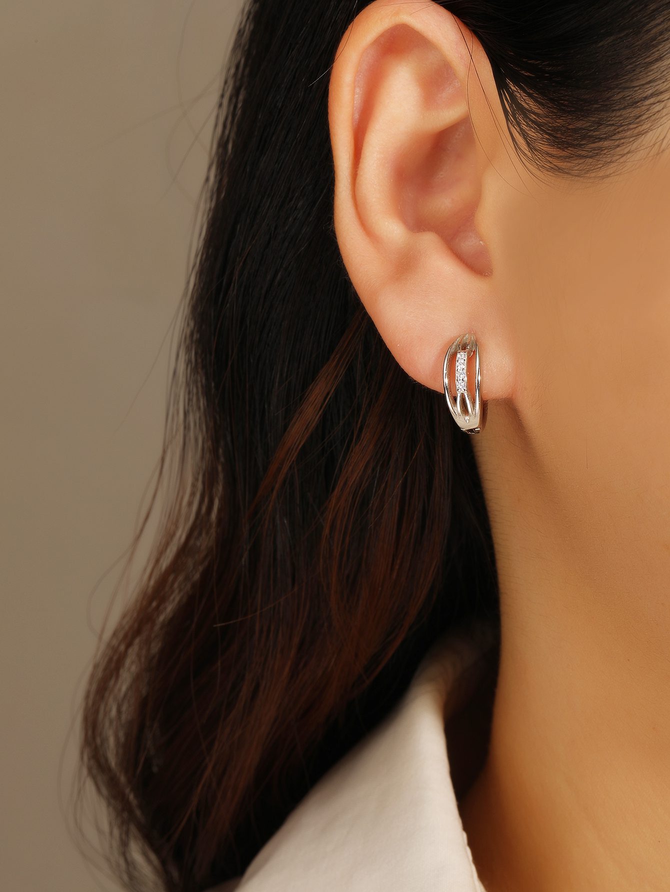 Circle Earrings with Zirconia Stones and a Band Design Featuring a Textured Pattern 1