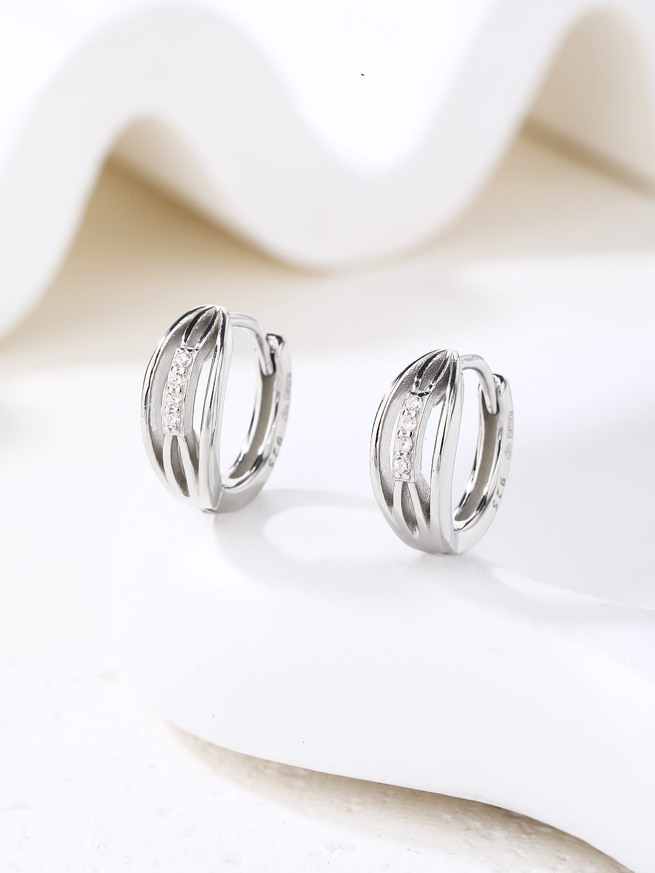 Circle Earrings with Zirconia Stones and a Band Design Featuring a Textured Pattern 4