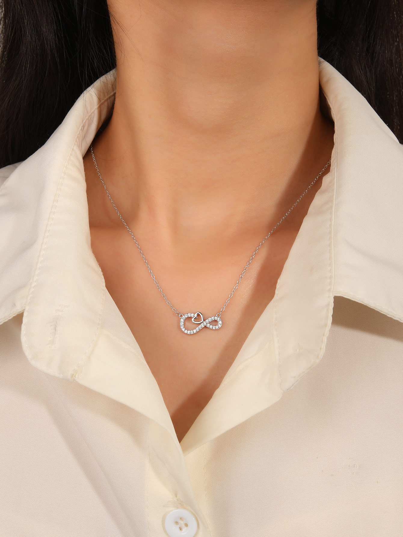 Silver necklace with infinity and heart motifs, set with cubic zirconia and rhodium-plated 4